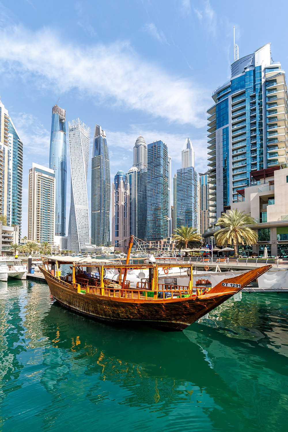 Dubai Marina skyline cityscape with skyscraper buildings at water portrait format luxury